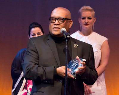 Dance educator Carlos Jones receiving an award