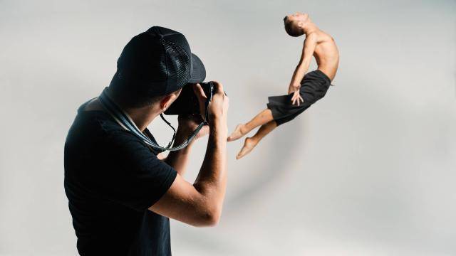 photographer shooting a young dancer jumping