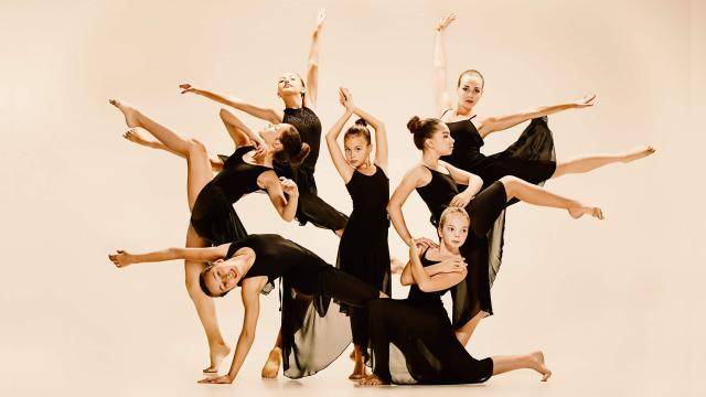 group of young contemporary dancers posing
