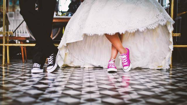 bride and groom feet wearing converse sneakers